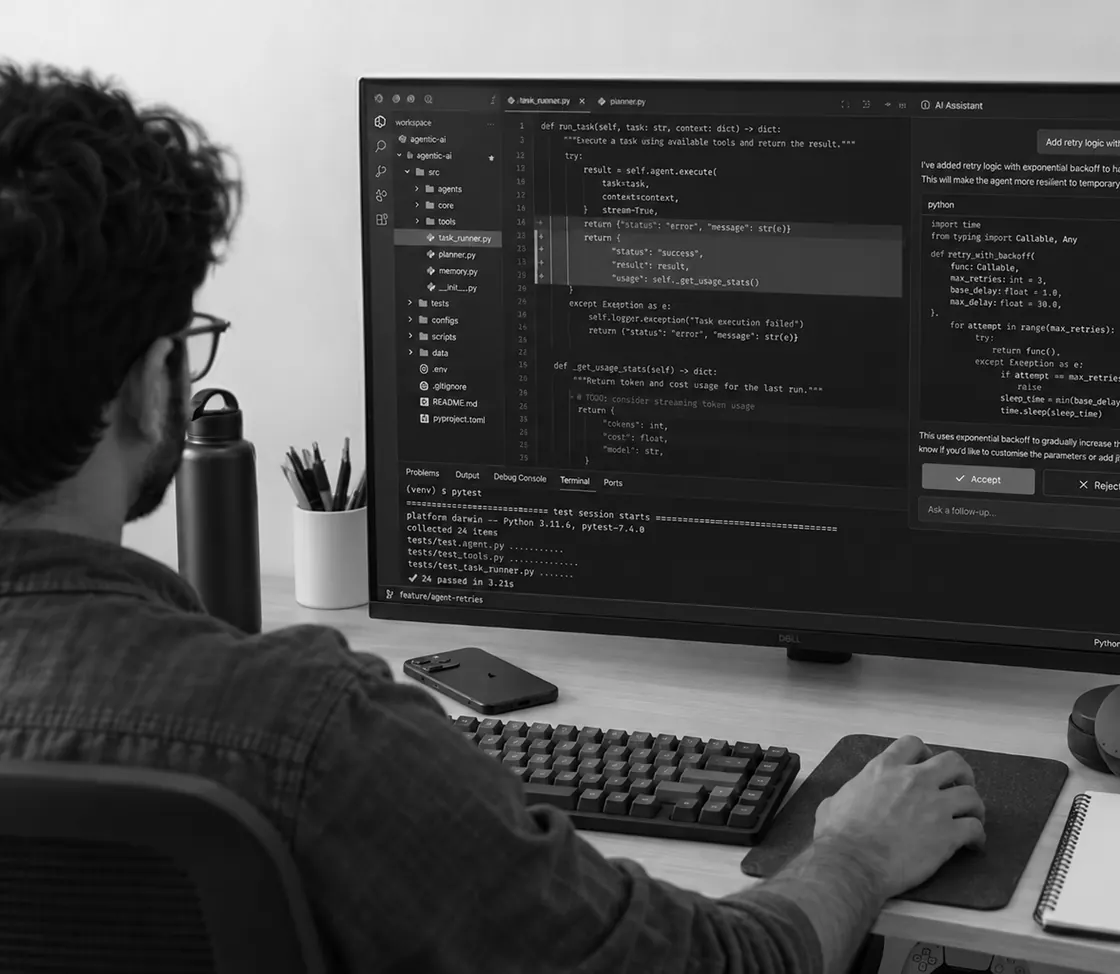 A developer writing code at a workstation
