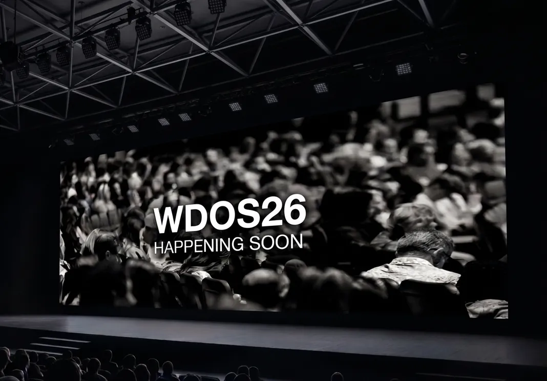 An auditorium screen reading WDOS26, happening soon